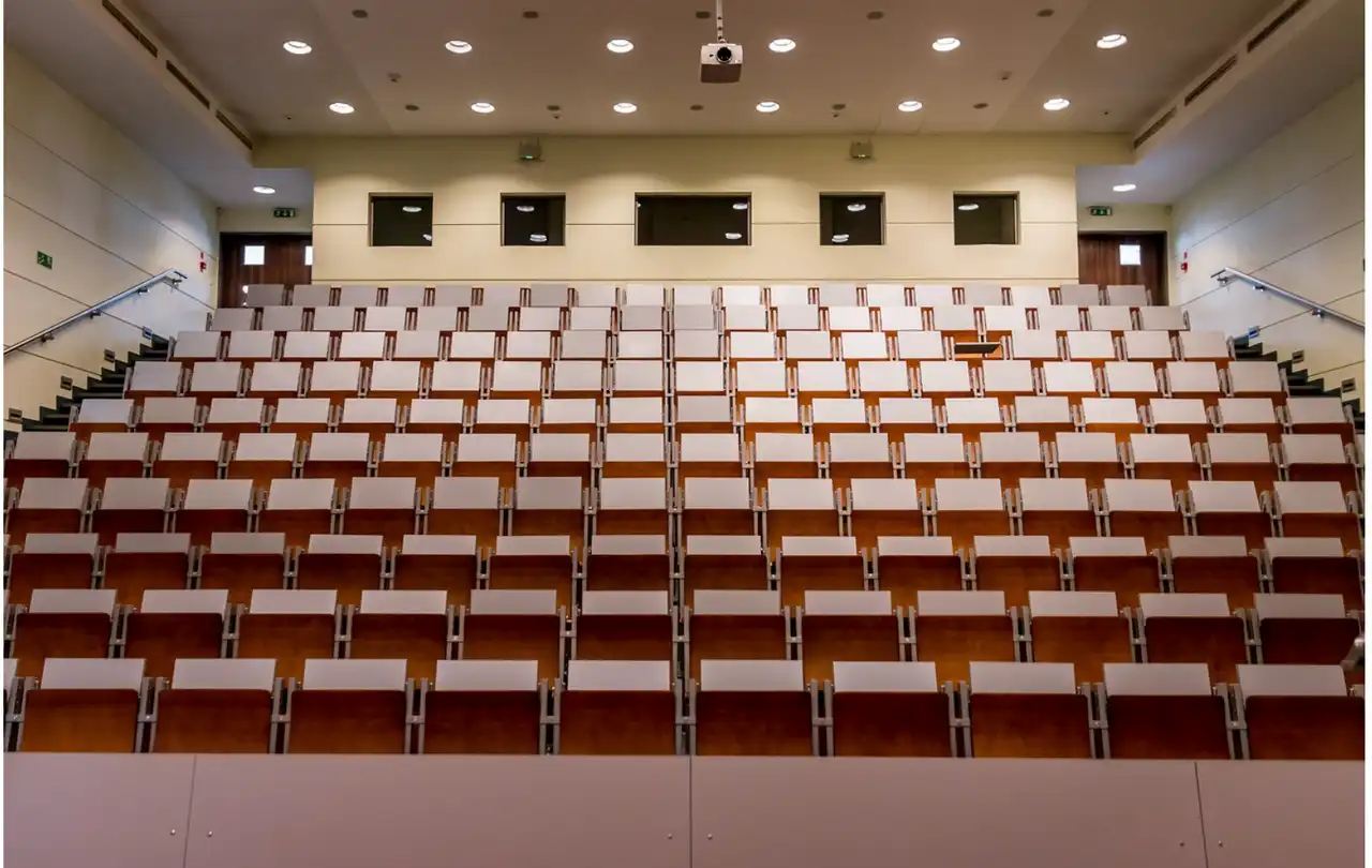 Commercial lecture hall with integrated AV system, illustrating environments where DB9 serial cables support AV control communication between devices