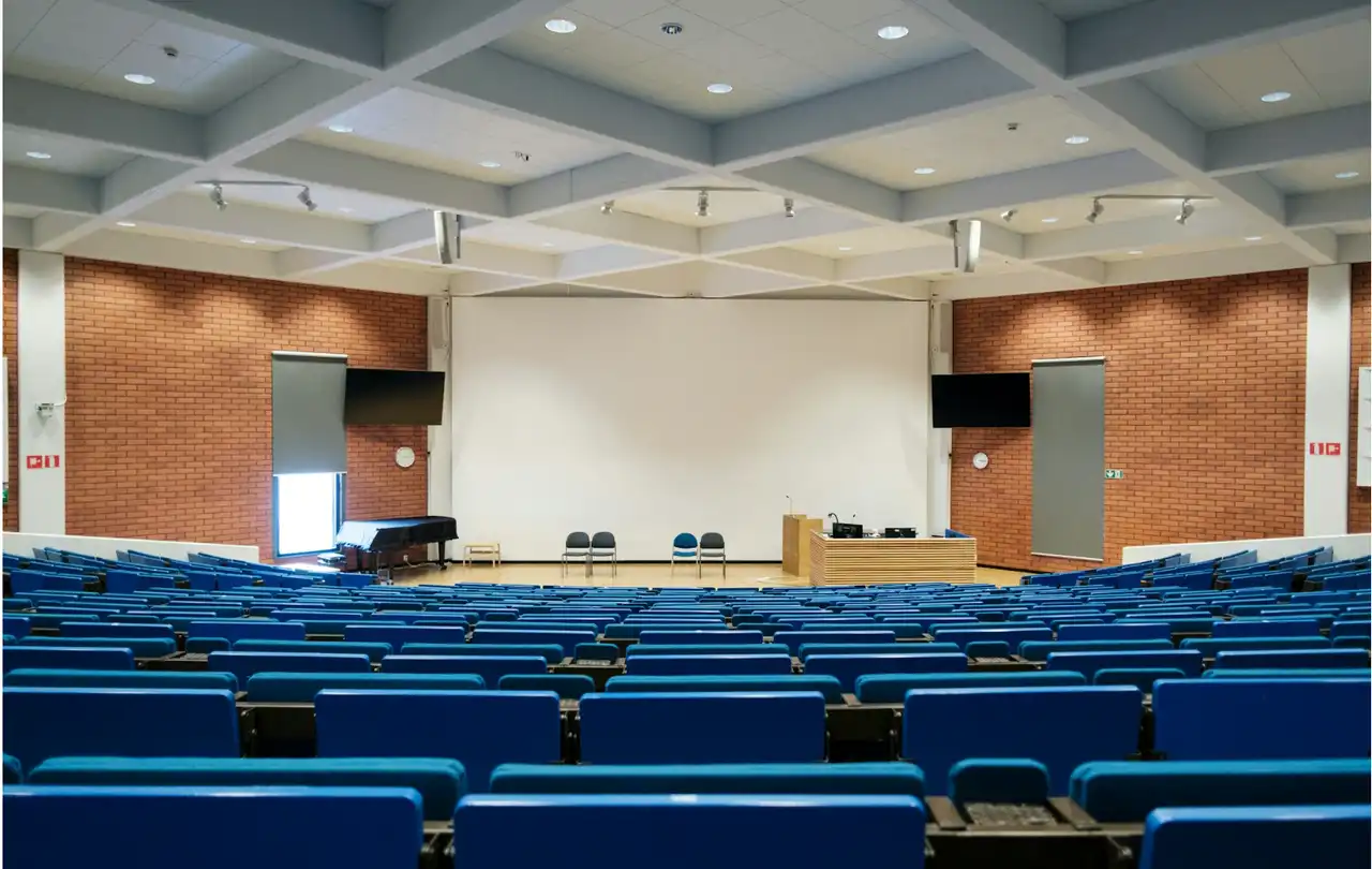Large lecture hall with integrated AV system, illustrating commercial environments where DB9 serial cables support RS-232 device control and system coordination