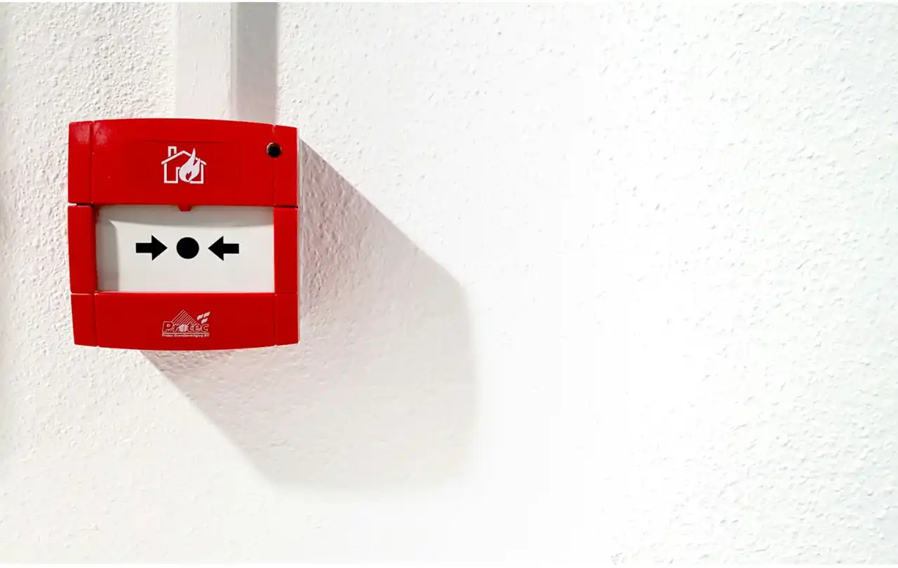 Fire alarm wall device in commercial building, illustrating life safety systems where 16 AWG fire alarm wire supports reliable signal and power distribution
