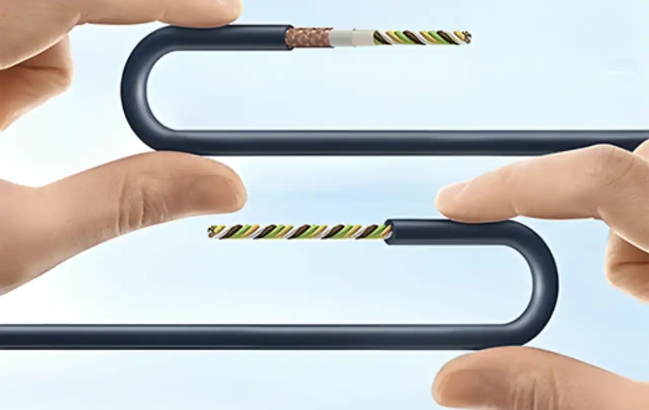 Alt Description: Image depicting a low voltage cable with multicolored twisted conductors being bent between a person’s thumb and forefinger to illustrate the bend radius of cable.