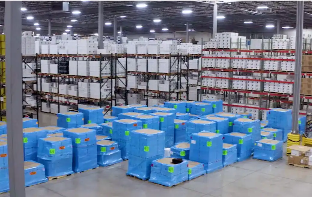 Windy City Wire warehouse with blue-wrapped pallets and stocked cable racks, staged for quick nationwide shipping