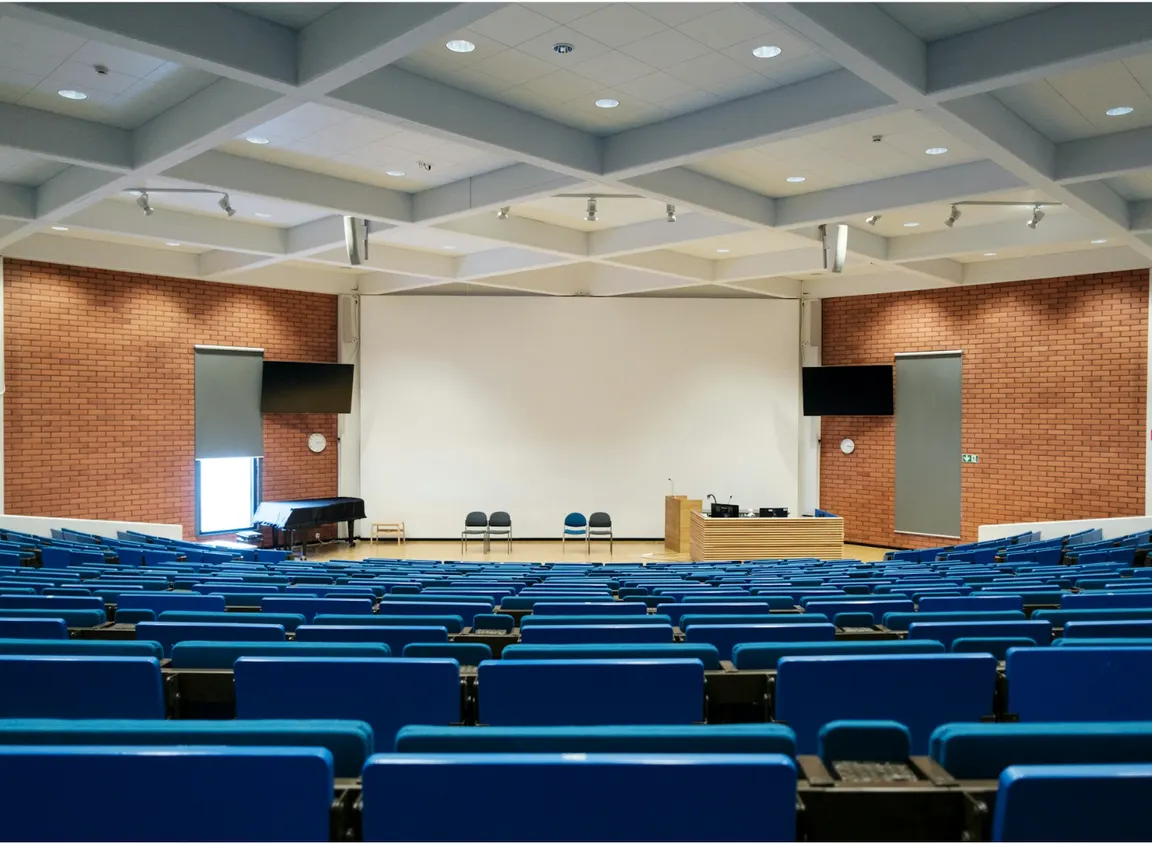 Large lecture hall with integrated AV system, illustrating commercial environments where DB9 serial cables support RS-232 device control and system coordination