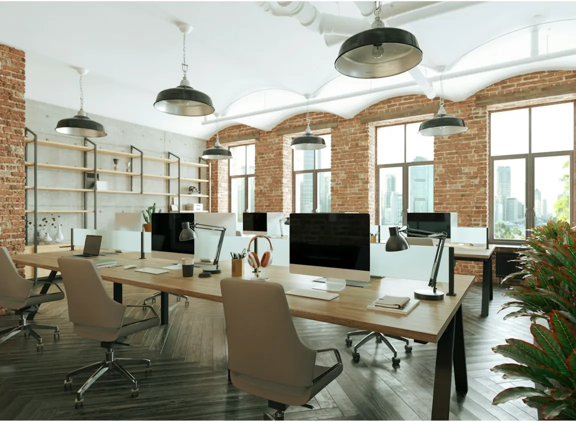 Modern commercial office workspace with computer workstations representing enterprise network infrastructure supported by OM1 and OM3 multimode fiber in commercial network design