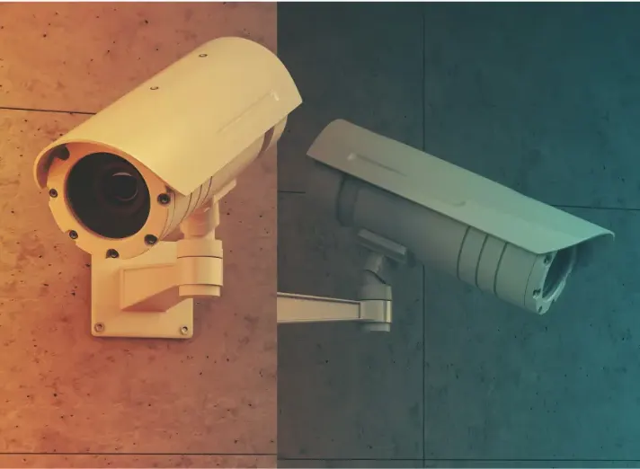 Two CCTV bullet cameras mounted on a wall, the type of security cameras connected using Cat5e or Cat6 camera wire