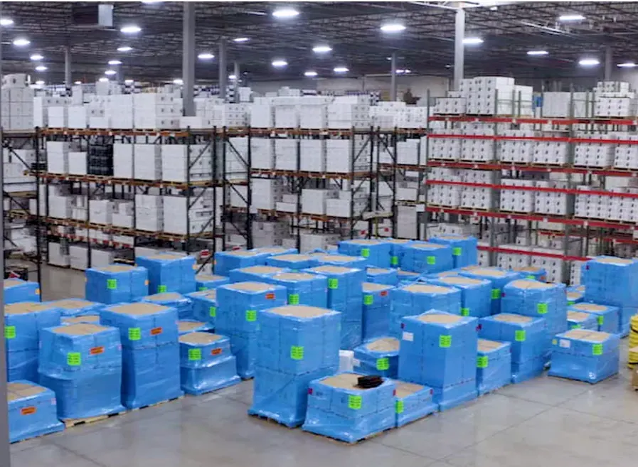 Windy City Wire warehouse with blue-wrapped pallets and stocked cable racks, staged for quick nationwide shipping