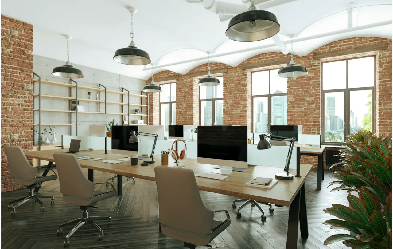 Modern commercial office workspace with computer workstations representing enterprise network infrastructure supported by OM1 and OM3 multimode fiber in commercial network design