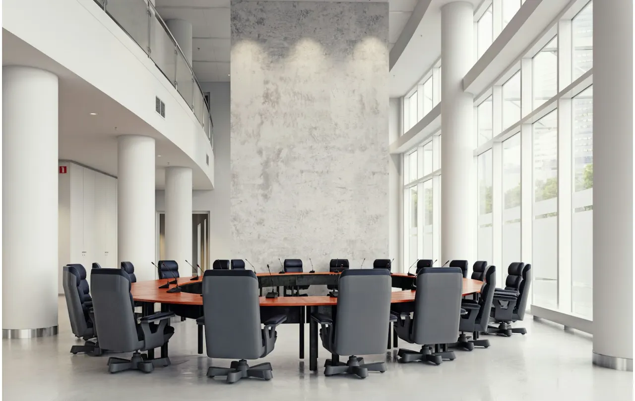 Modern commercial conference room with integrated AV system supporting mic line cable, Crestron and AMX control platforms for audio and automation
