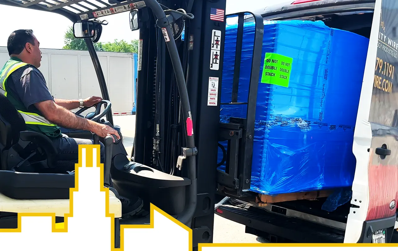 Forklift operator loading a shrink-wrapped pallet into a delivery van, highlighting fast logistics and nationwide wire and cable distribution.